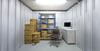 100 sq ft business storage unit neatly organised with office equipment, boxes, and shelving, offering an efficient space for small businesses to store inventory and essential supplies.