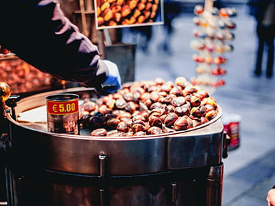 person selling chestnuts