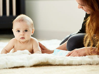 baby on a white mat