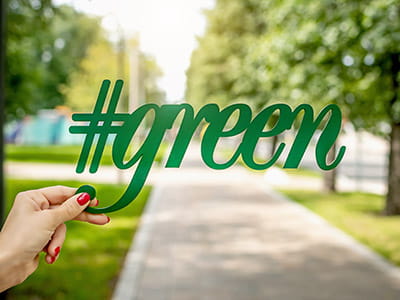 person holding green signage